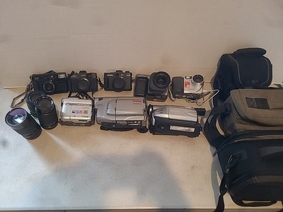 Lot of cameras and lens/ Camcorders And Bags And Accessories Not Tested  