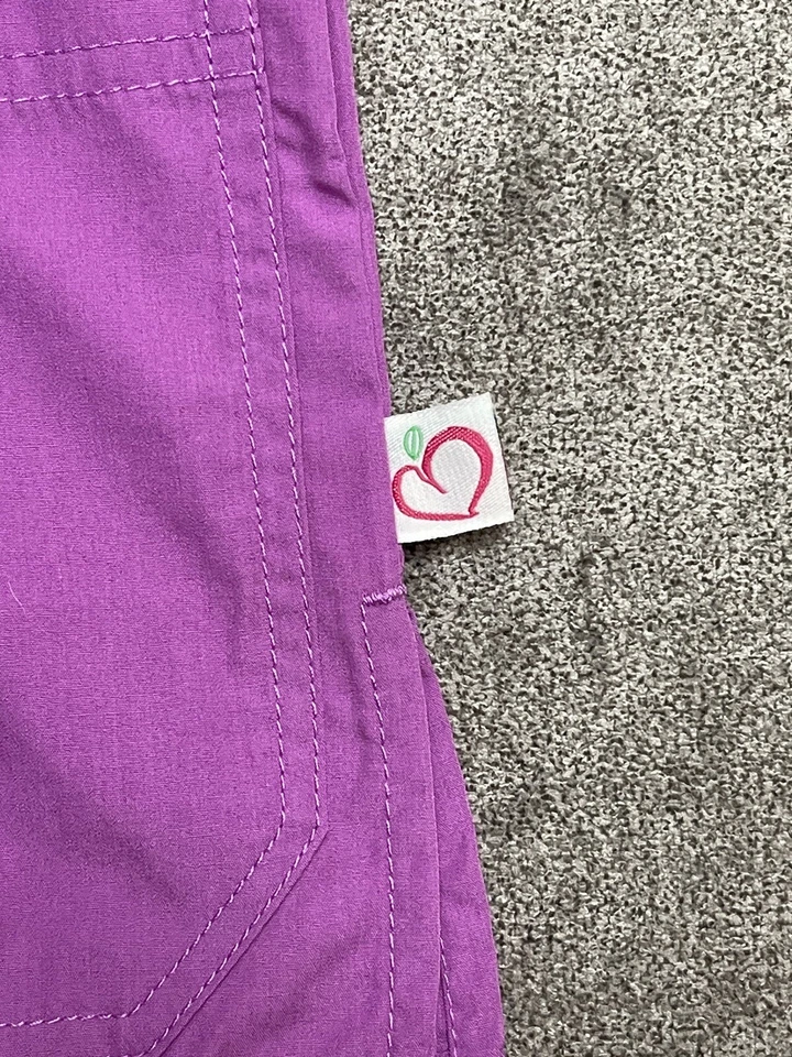 PEACHES NURSING Women’s UNIFORM BOLD BRIGHT BANDED CROSSOVER SCRUB TOP Purple - Image 4 of 4