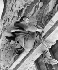 Oliver Reed ties a heavy line to a key beam of a mountainside in H- Old Photo