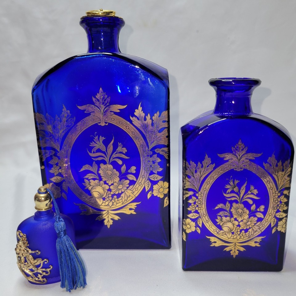 Bohemian cobalt blue and gold glass vanity bottles — jewel-toned and visually stunning on any shelf or dressing table.