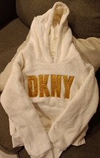 Toddler girl white DKNY sweater worn a few times but still in good codtion