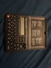 Multilingual Pocket Size Translator Organizer Calculator.