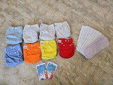 8 Fuzzibunz Cloth Diapers  18 Inserts  2 RLR Laundry Treatment