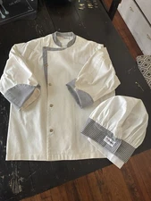 Chef Designs Chef’s Coat And Hat Black And White. Coat Size M, Hat Size L.