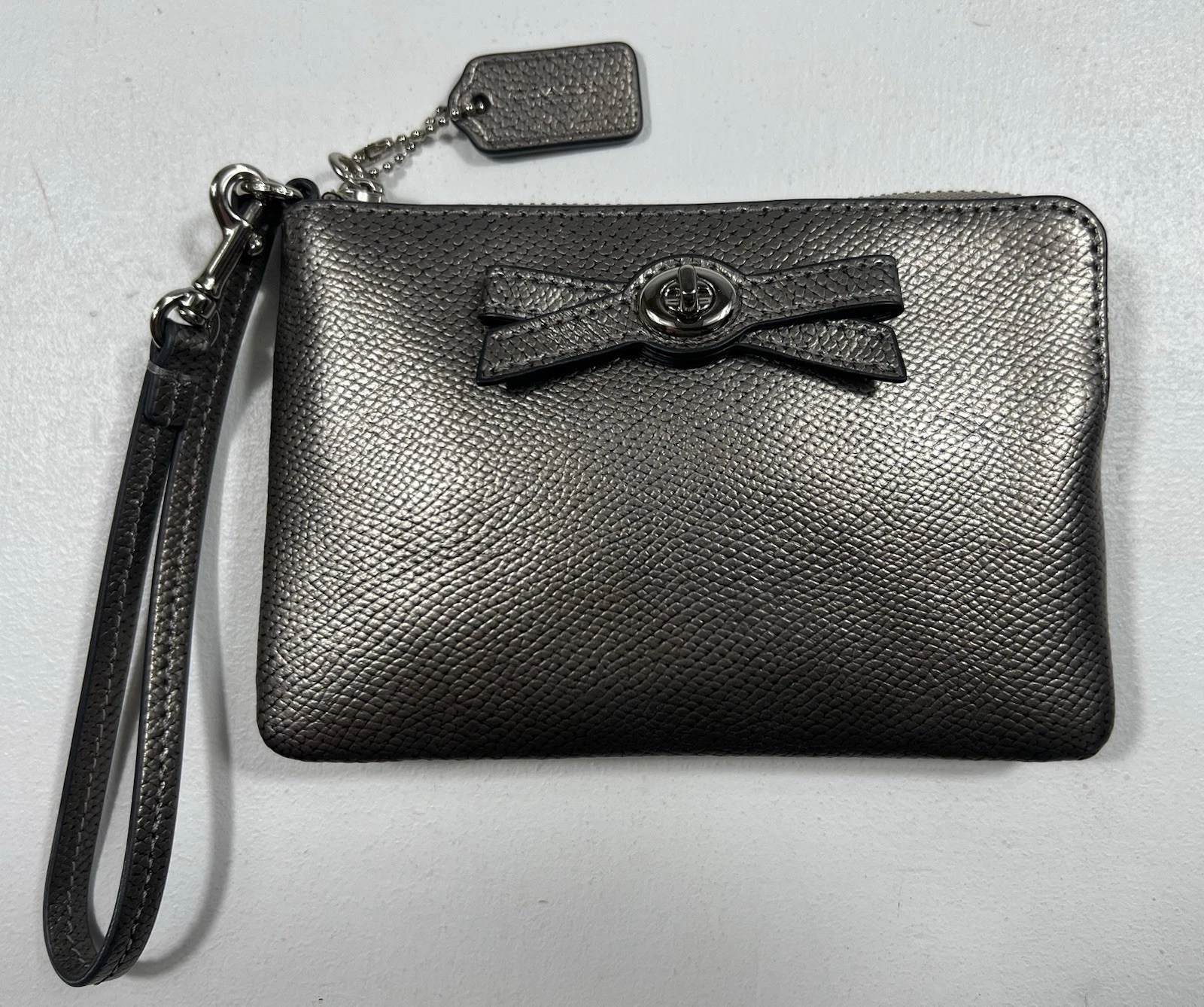 Portafoglio Coach piccolo Turnlock da polso peltro argento pelle fiocco accento us intime ottimeioni