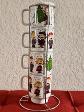 Peanuts Gang "Caroling Fun” Set Of 4 Stacking Mugs and Stand