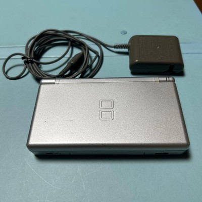 Used Nintendo DS Lite, silver, with charger. Used
