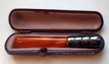Zigarettenspitze, Silber und Bernstein , wie Neu, mit Etui, Art Deco