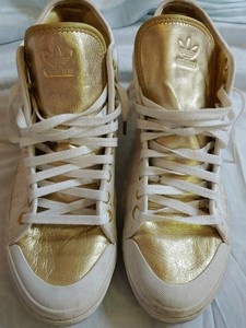 white and gold adidas high tops