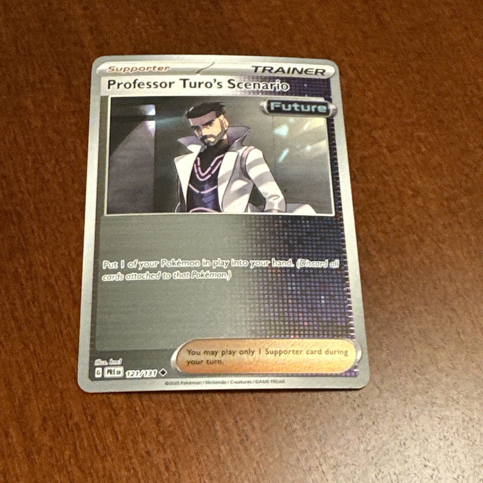 Professor Turo's Scenario 121/131 Sv: Prismatic Evolutions Reverse Holo NM