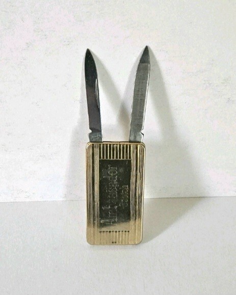 Ambassador Scotch money clip featuring penknife and nail file-image