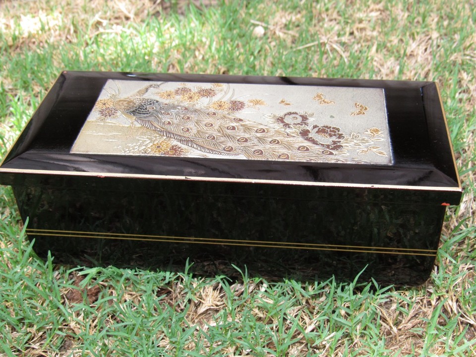 Japanese Chokin art (gold/silver engraving on black lacquer) meets peacock motif meets a music box that still works — a trifecta of vintage cool.