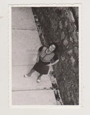 Woman with Cigarette Turns to the Camera in Cinematic Snapshot Abstract Unusual