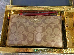 coach wristlet with charms