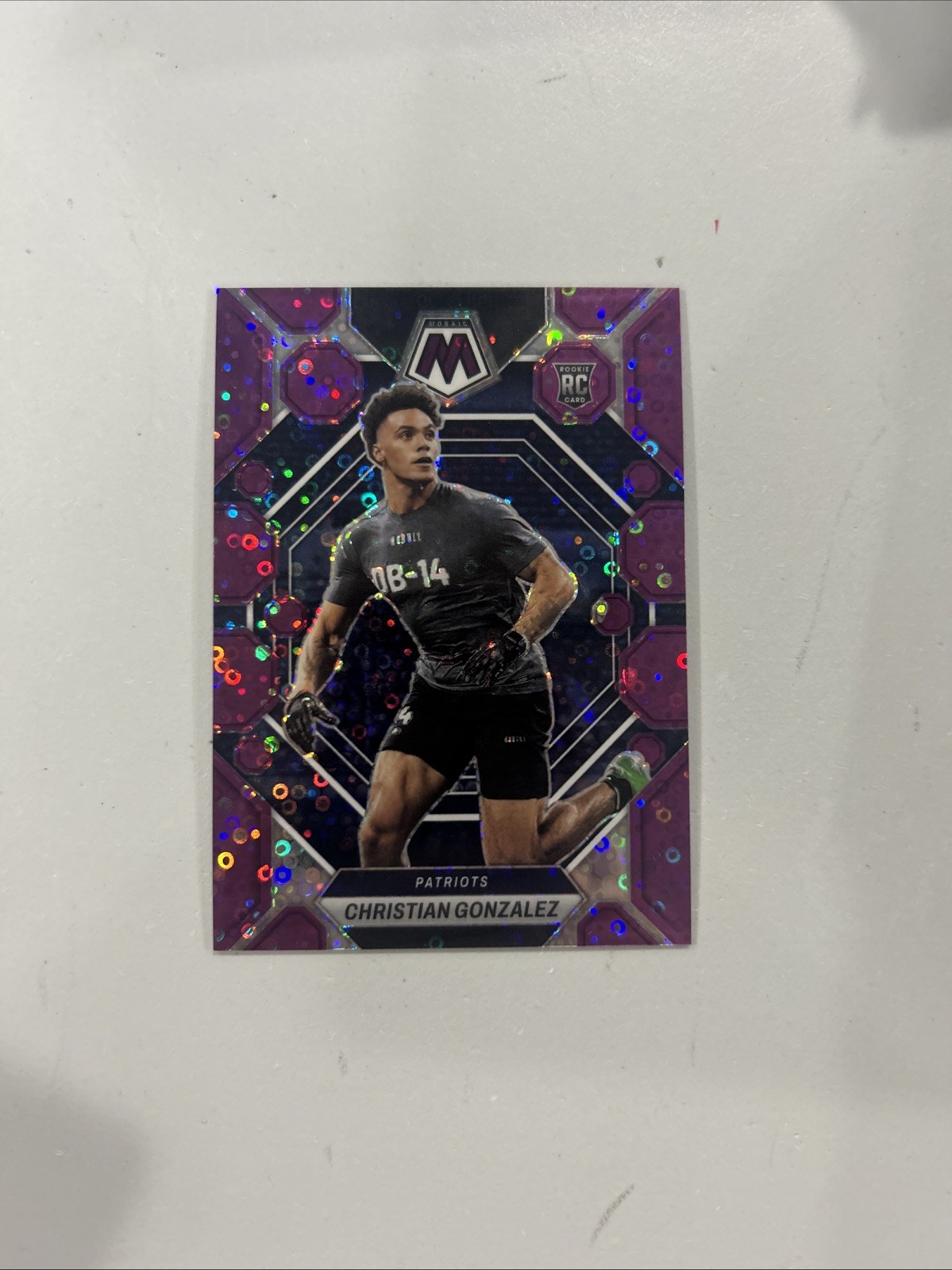 2023 Panini Mosaic #300 CHRISTIAN GONZALEZ NO HUDDLE PURPLE /50 ROOKIE