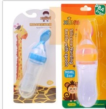 baby feeding bottles with spoons