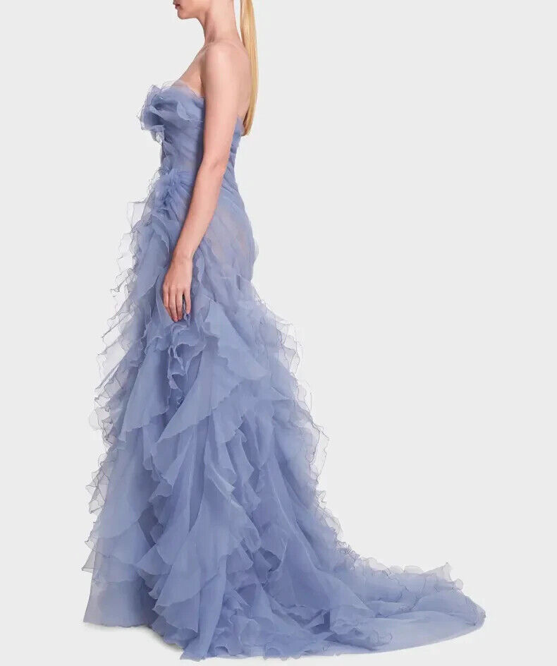 marchesa organza dress Co-founder and Creative Director @georginachapmanmarchesa at the Met Gala in Custom Marchesa: a finely draped strapless wire edged pleated organza gown in delicate blue to black ombr with sculptural petal details and