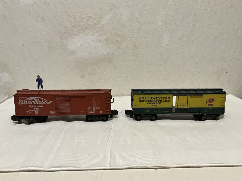 American Flyer S gauge 989 NW Reefer and 970 Seaboard action boxcar. 