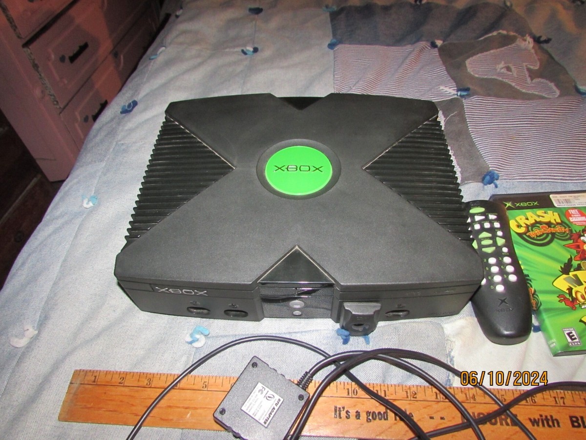 MICROSOFT X-BOX DVD WITH 4 GAMES, 2 REMOTES, WORKS FINE ALL CORDS