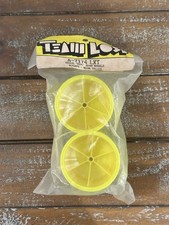 VINTAGE  A-7174  Team Losi LXT Rear Yellow Wheels w/ Discs  NEW IN PACK 
