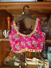 pink silk-blend embroidered Indian-style blouse with a floral pattern and yellow