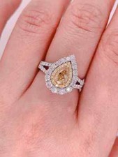 Featuring a 1.04CT Fancy Brownish Yellow Citrine With White CZ Double Halo Ring