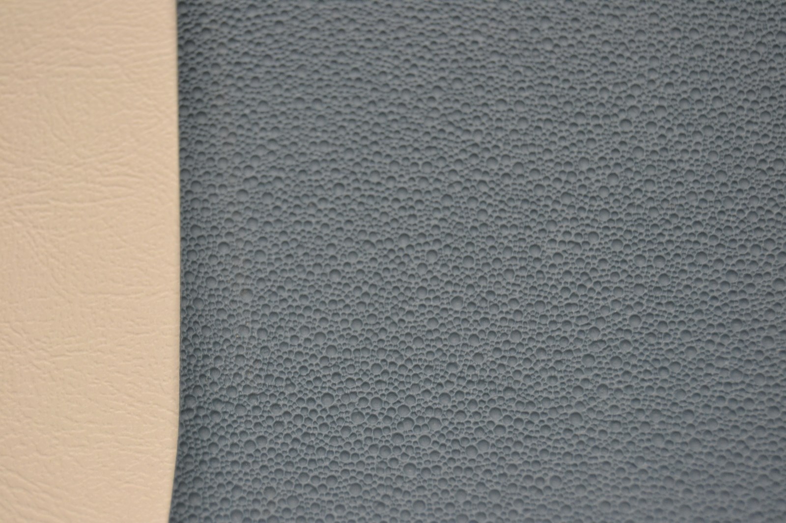Gray 1968-69 Ford Torino Fastback with medium blue headliner, mesh fabric, and tan leather side panels.