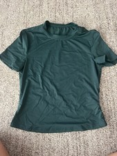 Tight dark green athletic top in size medium