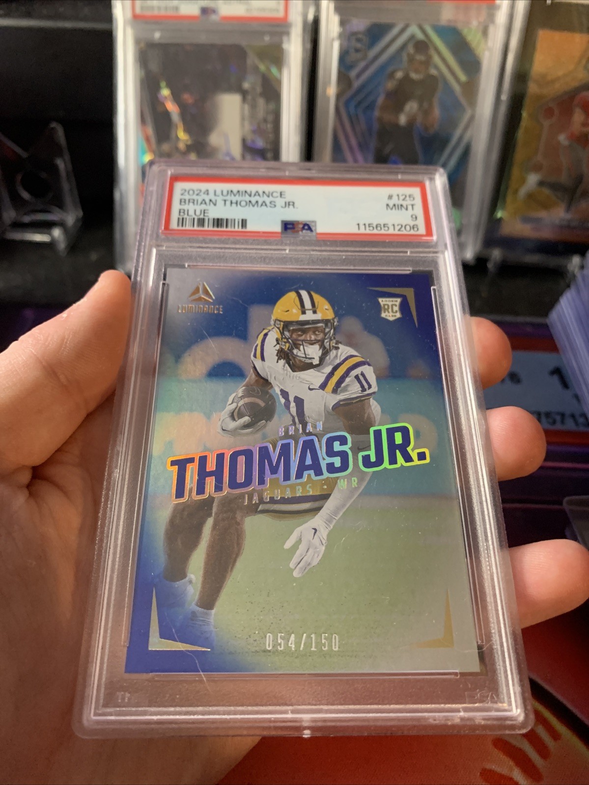 2024 Panini Luminance -Rookies Brian Thomas Jr. #125 Blue /150 PSA 9 POP 1👽🔥👀