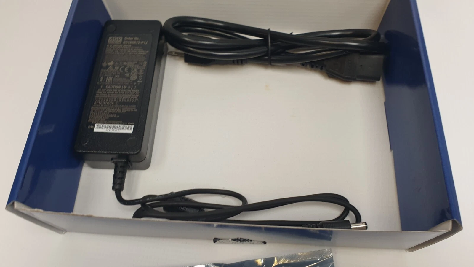 12V/5A desktop power supply and AC cord in the box