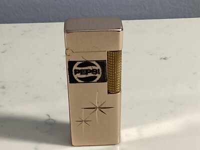 VINTAGE AUTHENTIC NESOR GOLD TONE PEPSI ADVERTISMENT LIGHTER VINTAGE AUTHENTIC NESOR GOLD TONE PEPSI ADVERTISMENT LIGHTER