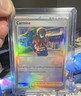 Pokémon Carmine 103/131 Sv: Prismatic Evolutions Ultra Rare Trainer Holo Card