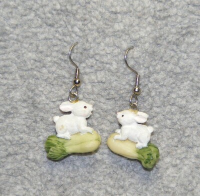 Easter earrings: small smiling white rabbit riding garden celery