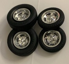 125 Chrome Halibrands With Knockoffs On Big And Little Dirt Track Tires.