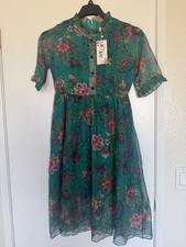 Charming kids dress featuring a vibrant floral pattern. Size S ,New w/Tag