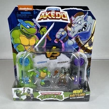MINT: Akedo - Teenage Mutant Ninja Turtles  Series 1 LEONARDO versus ROCKSTEADY