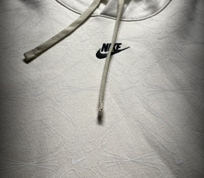 white nike hoodie with black swoosh all over