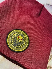 DAMIER LANGEVINÈ® SIGNATURE LION EMBLEM DESIGNER BEANIE SKULLY BURGUNDY HAT OS