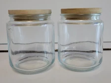 2 CLEAR GLASS ROUND CANISTER CONDIMENT JARS WOODEN LIDS 3.75 INCHES 10 OZS