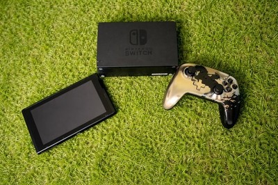 Nintendo Switch Console With Mario Carrying Case And Legend Of Zelda Controller