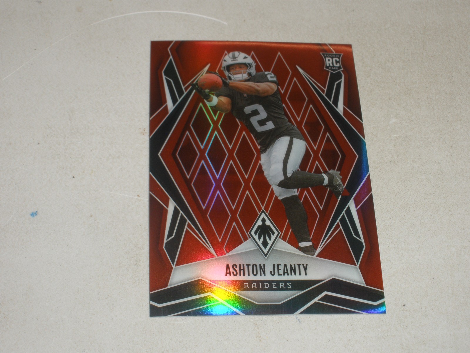 2025 Panini Phoenix Red Prizm #158 Ashton Jeanty 33/99 Rookie RC
