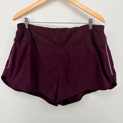 Athleta Be Free Running Shorts Maroon Burgundy Reflective Back Zip Pocket Womens