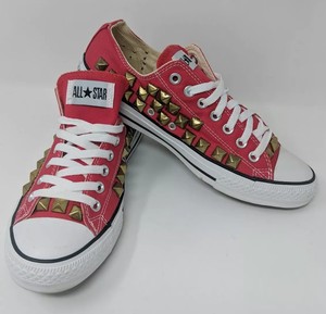 white sneakers with gold studs