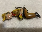 Marx donkey cart tin driver in nice shape. With bracket to attach to cart seat.