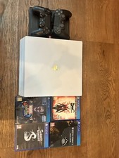 PS4 Pro 1tb 2x Duel shock controllers + Wireless charger dock + 4 games