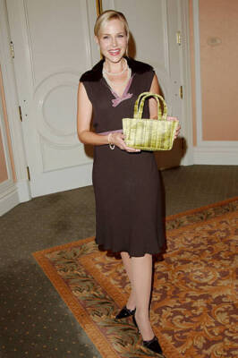 Julie Benz holding the handbag she donated at Lupus LA & InStyle M- Old Photo 3