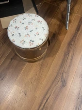 Vintage firkin repurposed as a sewing basket or footstool