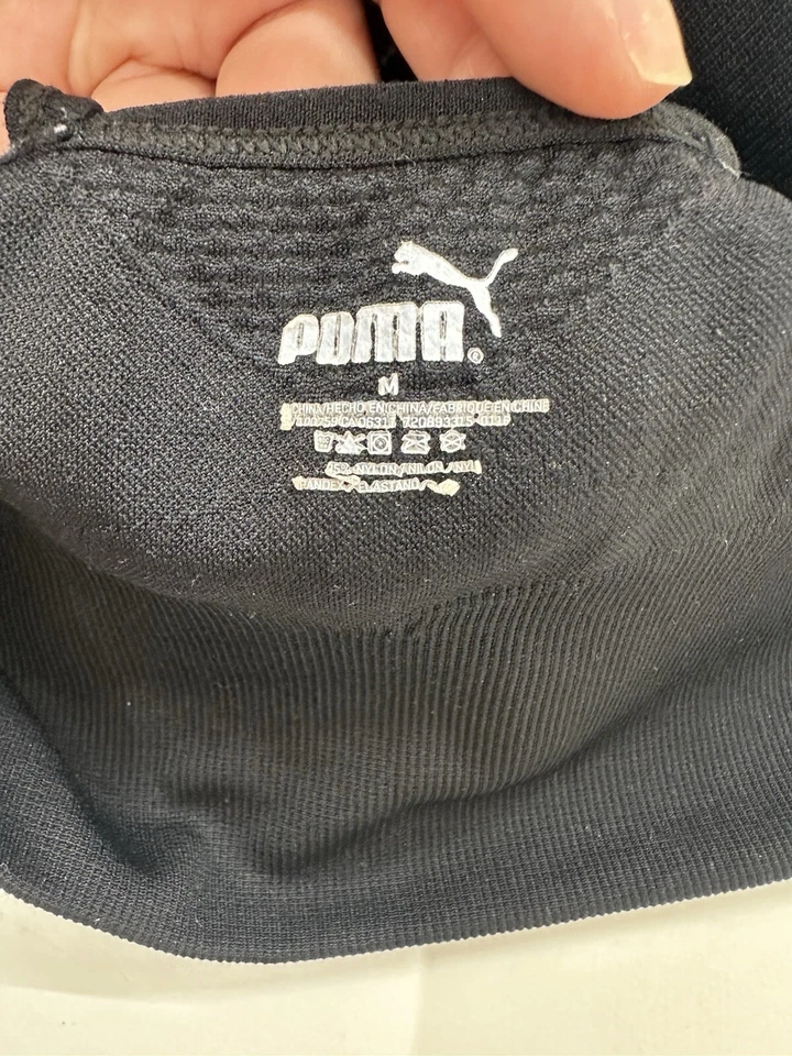 Sujetador deportivo Puma para mujer talla mediana negro sin costuras con tiras espalda deportiva sin relleno Foto 3 de 4