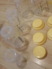 Lot of 4 MEDELA 5 oz. Bottles 3 w/ Caps and one 35 ml bottle with cap
