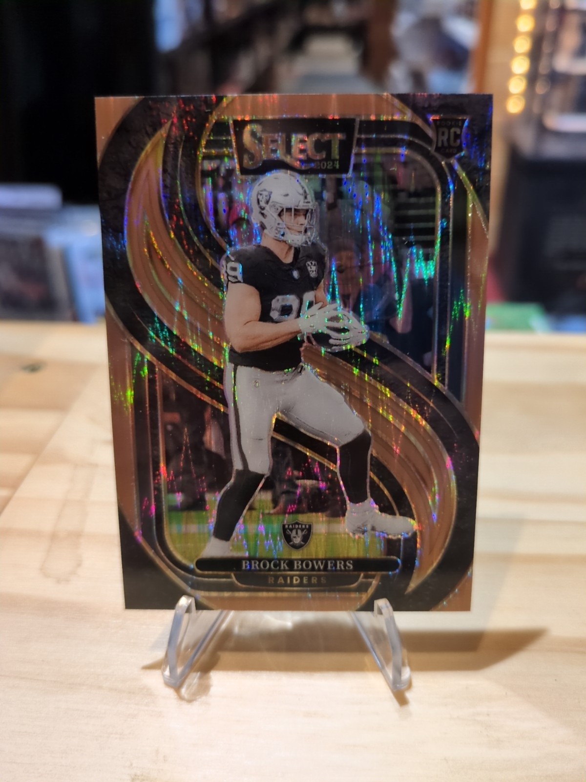 Brock Bowers 2024 Panini Select #118 Premier Level Bronze Prizm Shock /299 OT